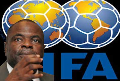 Amos_Adamu_in_front_of_FIFA_logo