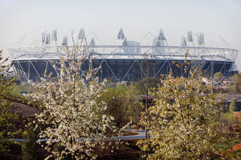 London_2012_Olympic_Stadium_with_flowers_April_11_2011