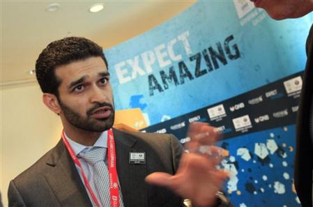 Hassan al_Thawadi_in_front_of_Expect_Amazing_logo