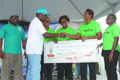 Jack Warner_and_giant_cheque_Trinidad_July_2011