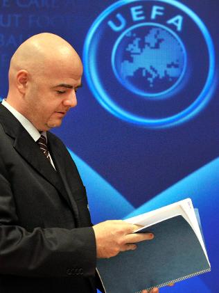 gianni infantino_looking_though_the_books