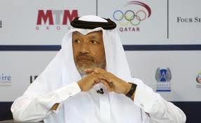 Mohamed Bin_Hammam_in_front_of_Qatar_Olympic_Committee_logo
