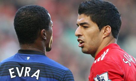 Luis-Suarez-and-Patrice-Evra 24_July