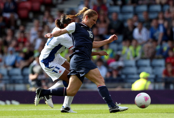 Rachel Buehler_of_USA_is_tackled_by_Marie-Laure_Delie_of_France