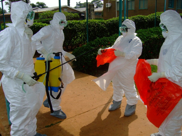 Officials from_the_WHO_wear_protective_clothing_as_they_prepare_to_enter_Kagadi_Hospital_in_Kibale_District_where_an_outbreak_of_Ebola_virus_started