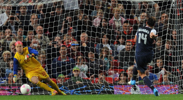 US forward_Abby_Wambach_scores_a_penalty_past_Canadas_goalkeeper_Erin_Mcleod