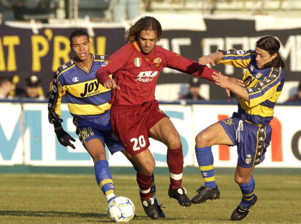 Gabriel Batistuta_of_Roma_runs_between_Matteo_Ferrari_and_Matias_Almeyda_of_Parma