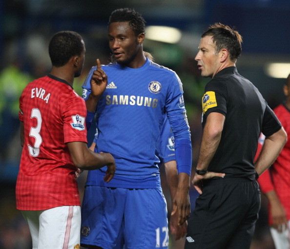 Jon Obi_Mikel_C_of_Chelsea_complains_to_referee_Mark_Clattenburg