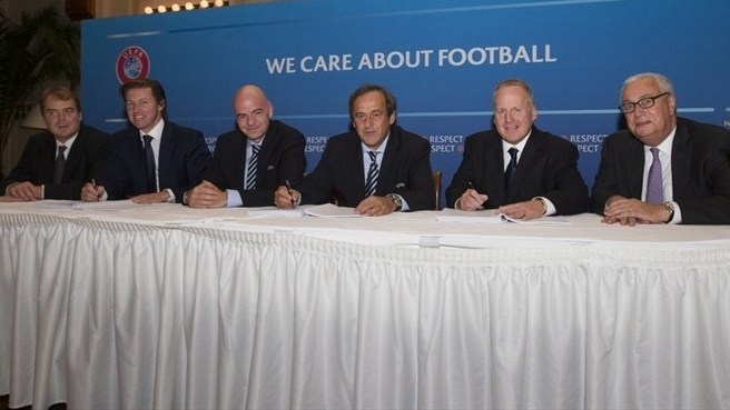 Michel Platini_and_Gianni_Infantino_in_St_Petersburg_are_on_left_Stphane_Schindler_and_Olivier_Guiguet_from_CAA_Eleven_and_on_right_David_OConnor_and_Michael_Rubel_from_Creative_Artists_Agency