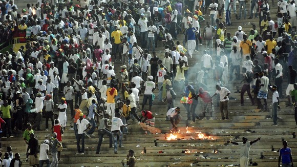 Senegalese football_fans_light_fires_at_the_Leopold_Sedar_Senghor_stadium_in_Dakar