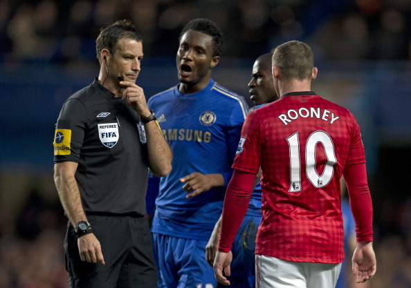 John Mikel_Obi_2nd_L_talking_with_referee_Mark_Clattenburg