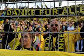 fans standing on terraces