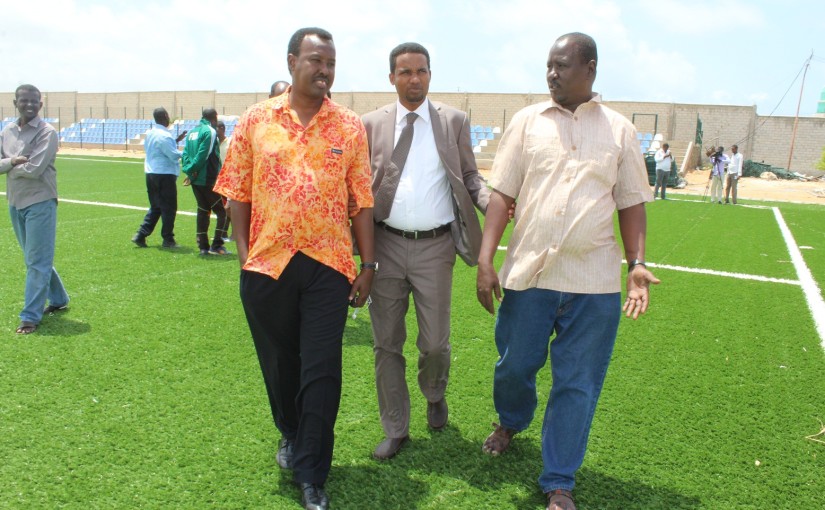 From letft Somali FA president Abdiqani said Arab minister for sport Mohamed Abdullahi Hassan and SFF Senior Vice president Ali Abdi Mohamed walk inside the University stadium PHOTO SFF