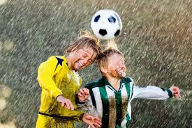 Youths heading the ball