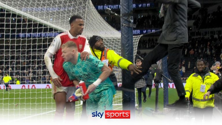 Arsenal goalkeeper Aaron Ramsdale appears to be kicked by