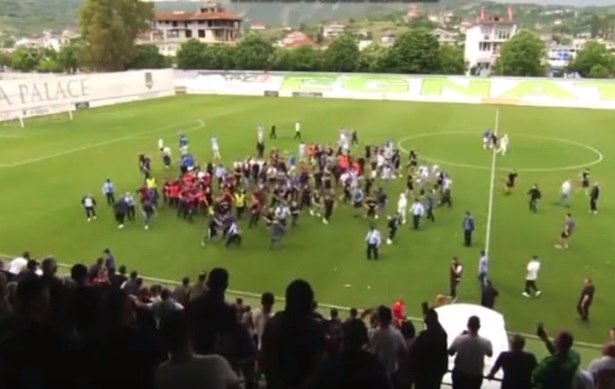 FK Tirana ultras storm pitch and attack officials after late